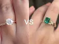 A classic solitaire engagement ring meaning is timeless love. This image shows a diamond solitaire vs. an emerald ring.