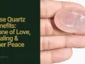 A hand holds a polished rose quartz stone, showcasing its soft pink hue and faceted surface. Discover the rose quartz benefits for love, healing, and inner peace.