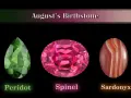 August's birthstone collection: a green peridot, a pink spinel, and a striped sardonyx.