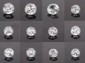Twelve sparkling stones that look like diamonds, each with brilliant facets, are arranged in a grid on a dark, reflective surface.