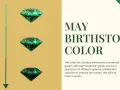 Three emeralds, the May birthstone, are displayed against a golden background. Text reads "MAY BIRTHSTONE COLOR.