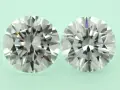 Two round brilliant cut diamonds, one a diamond simulant and the other lab grown, are shown side-by-side on a pale green background.