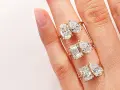 Three rings, each with two diamonds, symbolize the "toi et moi" meaning of "you and me.