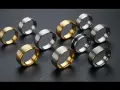 A collection of men's wedding bands in various metals like gold, silver, and black, showcasing the best metal for men's wedding band options.