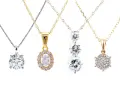 Four elegant diamond chains showcase different styles: a solitaire, an oval halo, a cascading trio, and a cluster pendant.