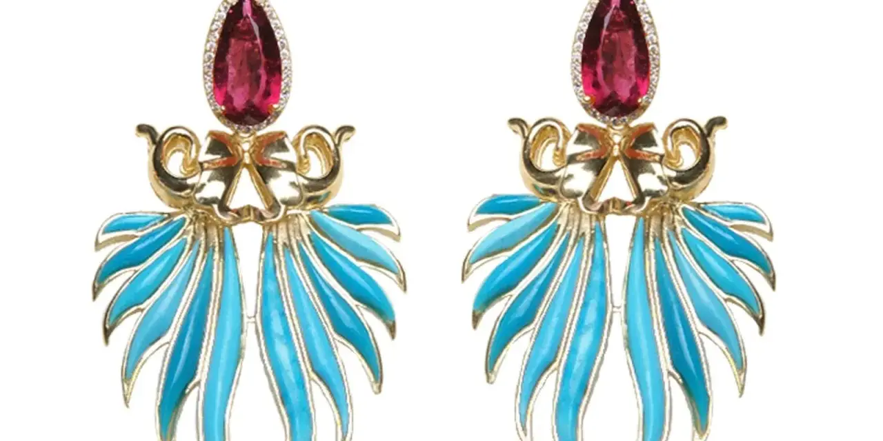 Exquisite gold earrings featuring a teardrop ruby and vibrant blue enamel, reminiscent of the rich colors found in brazilian stones.