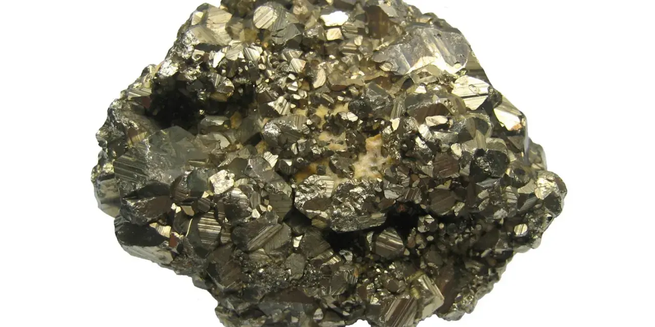 A cluster of metallic, brass-colored crystals, likely pyrite, showcasing its cubic structure. This specimen highlights the visual differences when comparing marcasite vs pyrite.