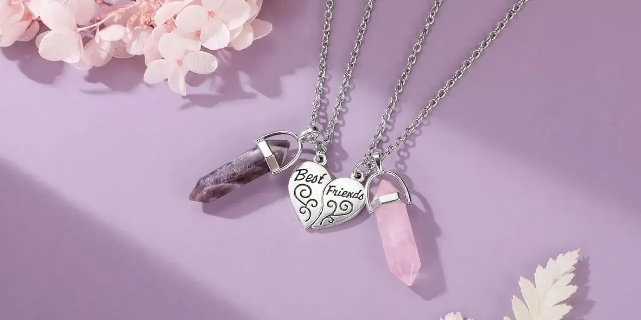 Two necklaces with amethyst and rose quartz crystals, symbolizing the enduring bond of friendship.