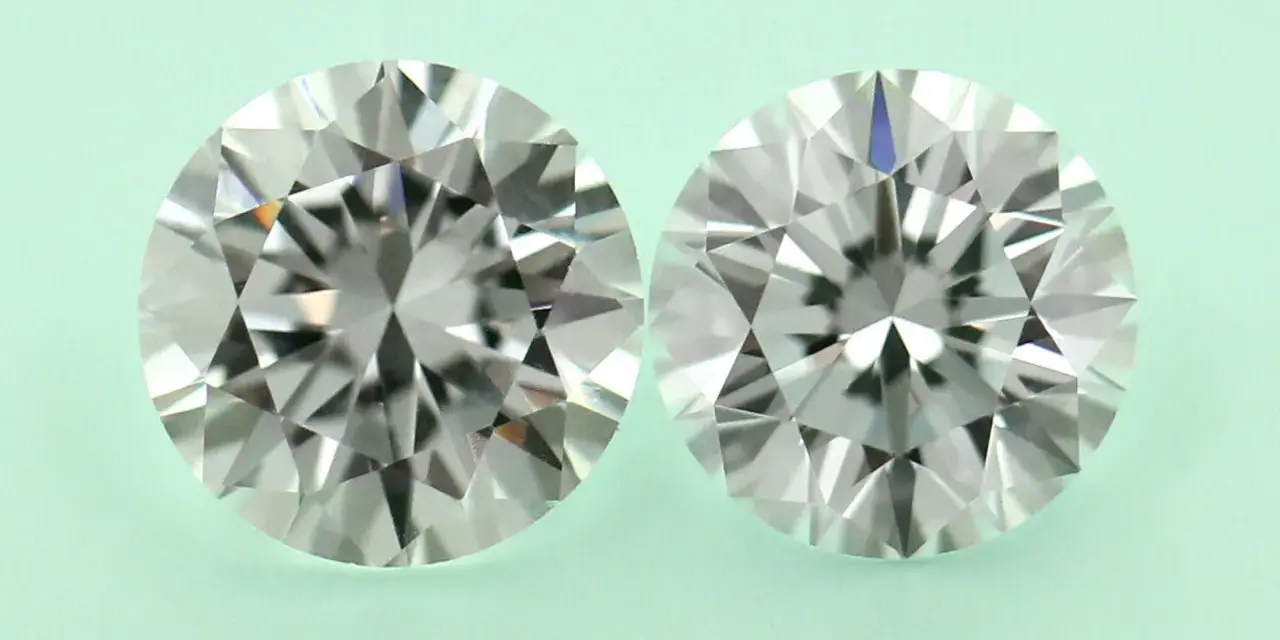 Two round brilliant cut diamonds, one a diamond simulant and the other lab grown, are shown side-by-side on a pale green background.