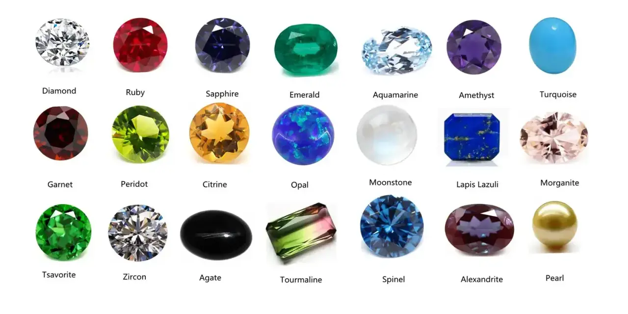 A collection of colorful gemstones, including a clear diamond, red ruby, blue sapphire, green emerald, and a pinkish morganite, a type of feldspar gemstone.