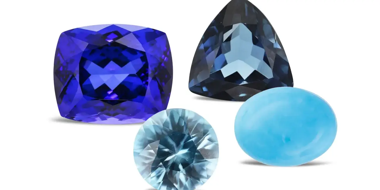 A cushion-cut tanzanite, a trillion-cut blue topaz, and a cabochon-cut turquoise are shown, representing what are December birthstones.
