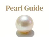 A single, lustrous pearl sits on a white background, with "Pearl Guide" text above. Is a pearl a jewel? This image suggests yes.