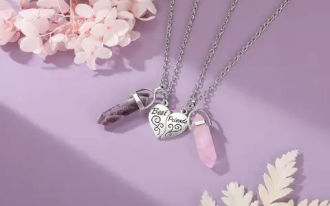 Two necklaces with amethyst and rose quartz crystals, symbolizing the enduring bond of friendship.