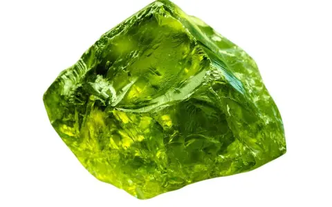 A rough, translucent green crystal, like an emerald, represents growth, renewal, and prosperity.