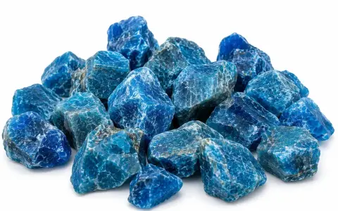 A pile of rough, blue apatite crystals. The apatite crystal meaning is often associated with motivation and ambition.