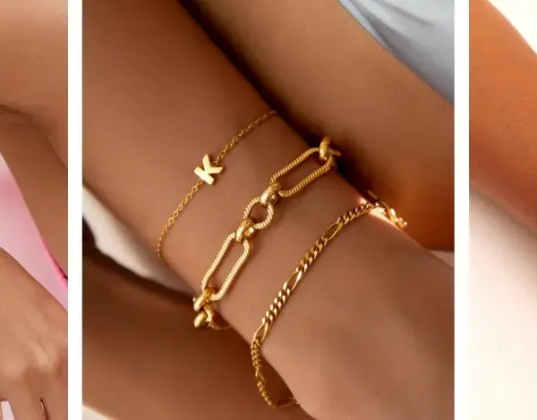 Showcasing the stacking bracelets trend with gold and silver bangles, chains, and a personalized initial charm.