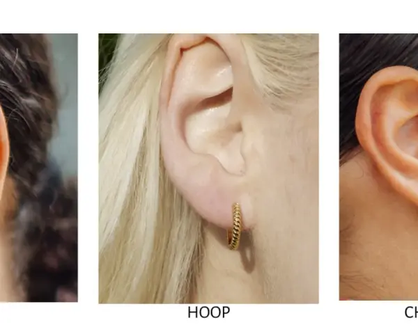 Close-up of ears showcasing different earring styles: huggie earrings, a twisted hoop, and a charm hoop with a spike pendant.