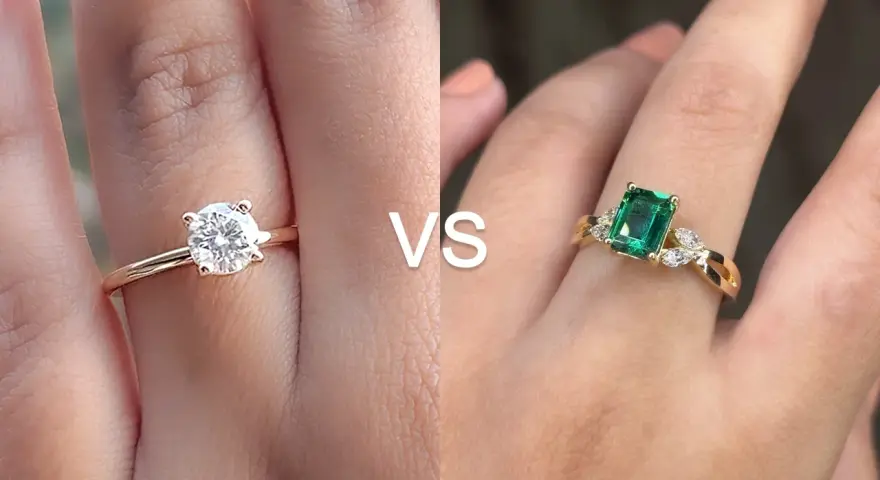 A classic solitaire engagement ring meaning is timeless love. This image shows a diamond solitaire vs. an emerald ring.