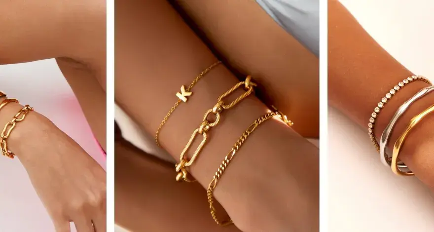 Showcasing the stacking bracelets trend with gold and silver bangles, chains, and a personalized initial charm.