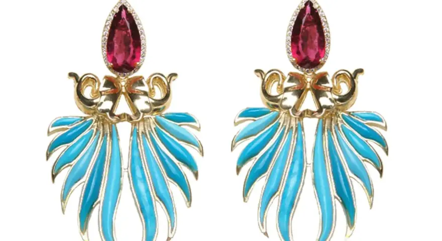Exquisite gold earrings featuring a teardrop ruby and vibrant blue enamel, reminiscent of the rich colors found in brazilian stones.