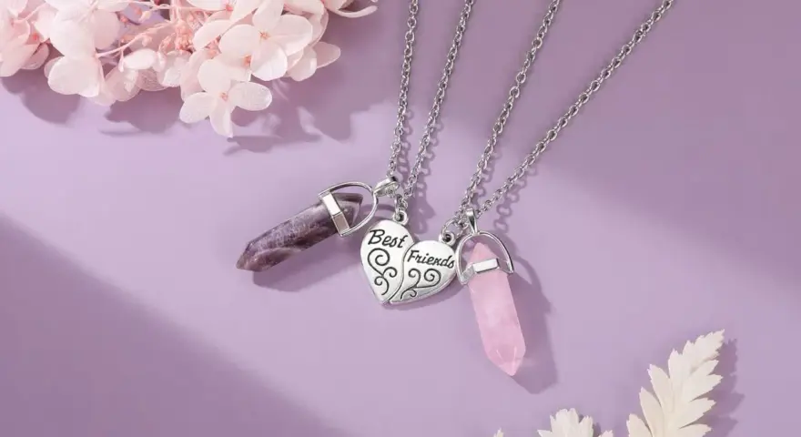 Two necklaces with amethyst and rose quartz crystals, symbolizing the enduring bond of friendship.
