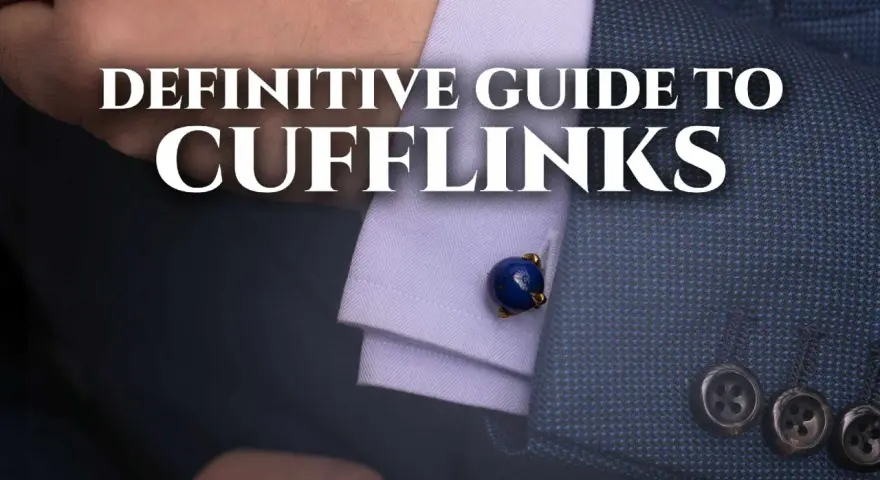 A close-up of a man's suit sleeve shows a blue lapis lazuli cufflink. This image is part of a definitive guide to cufflinks.