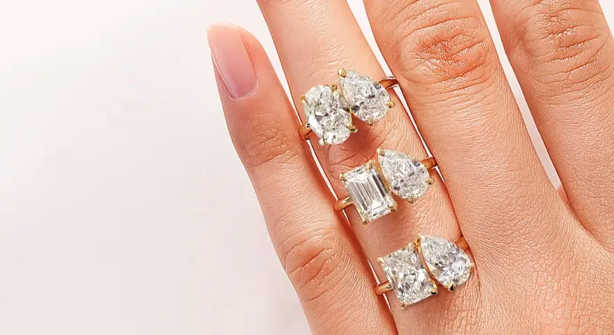 Three rings, each with two diamonds, symbolize the "toi et moi" meaning of "you and me.
