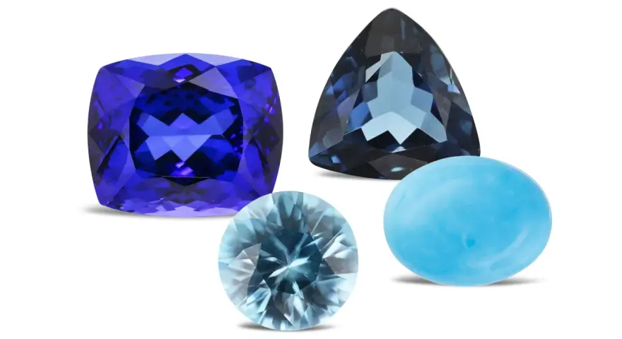 A cushion-cut tanzanite, a trillion-cut blue topaz, and a cabochon-cut turquoise are shown, representing what are December birthstones.