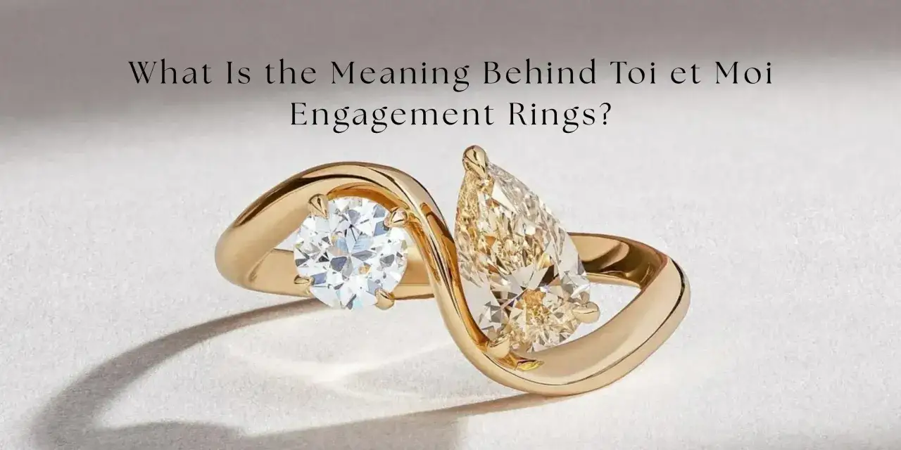 A gold ring with two diamonds, a round and a pear-shaped, symbolizing the toi et moi meaning of 