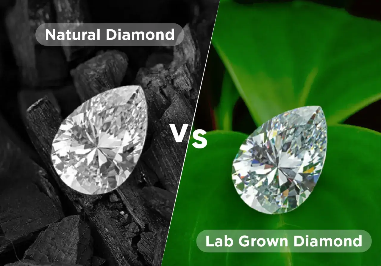 A pear-shaped diamond on charcoal, labeled 