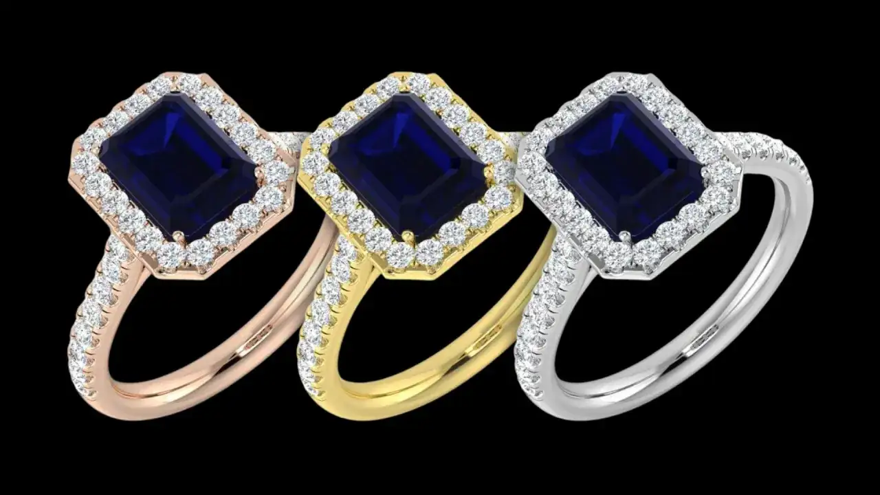 Three emerald-cut sapphire rings, the september 5 birthstone, are showcased in rose gold, yellow gold, and white gold settings, each surrounded by a halo of diamonds.